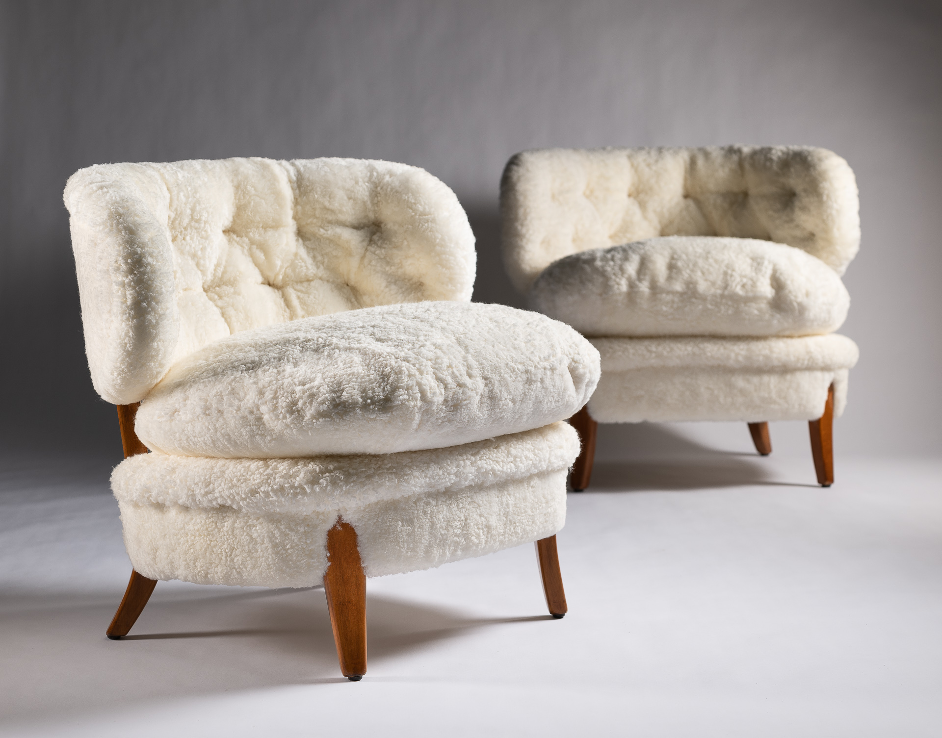 Pair of “Otto Schultz” armchairs white shearling