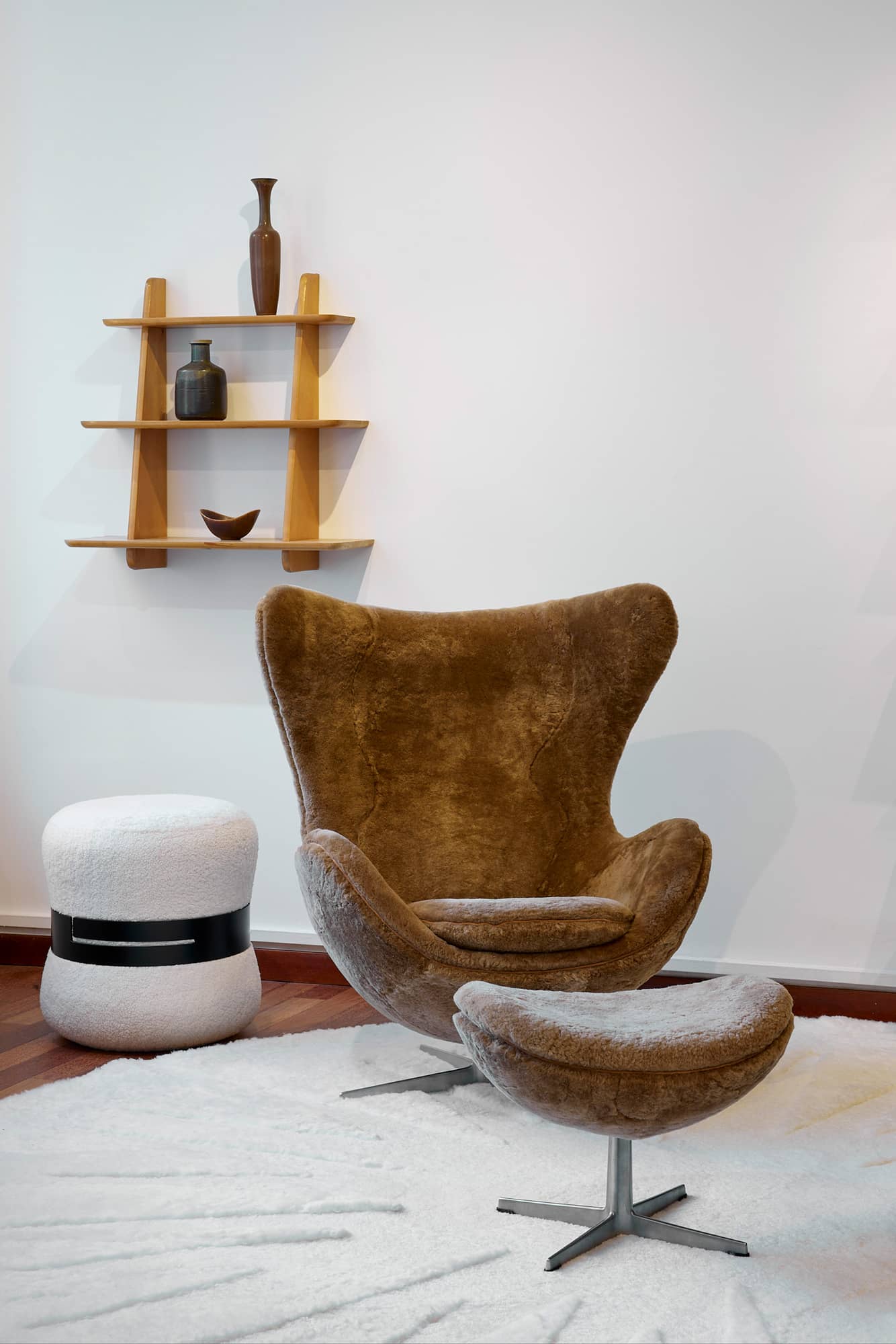 Egg armchair and vintage ottoman in camel