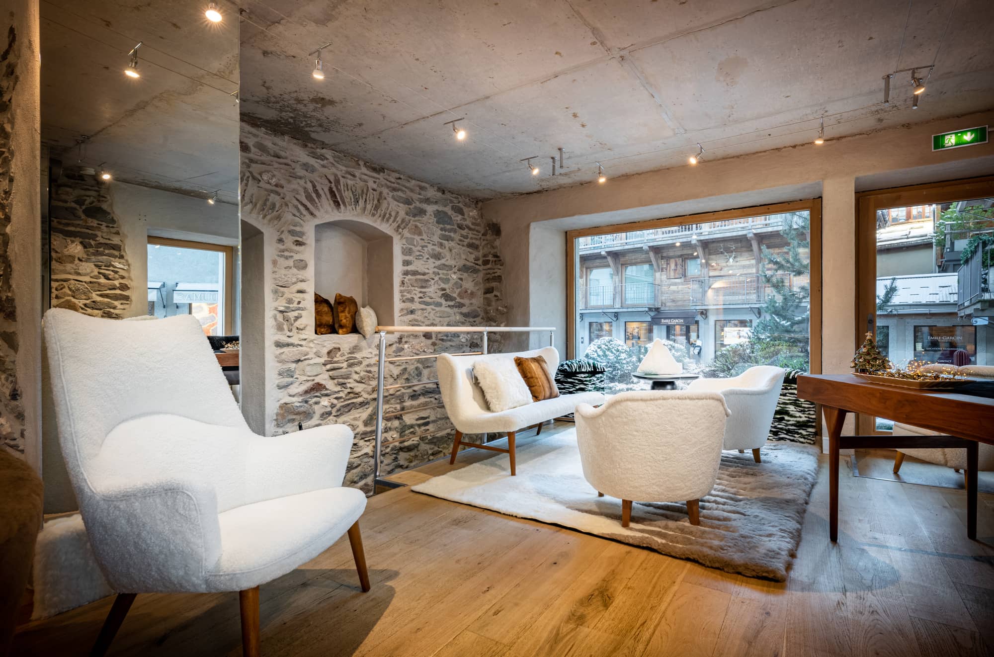 White vintage armchair in Norki Alps France showrrom at Megeve